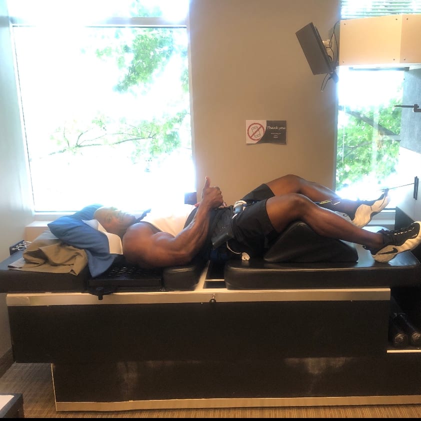 Patients on therapy tables in the clinic’s treatment room