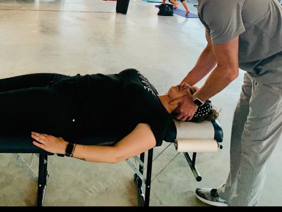 Dr. Currington treating an athlete at a sports event